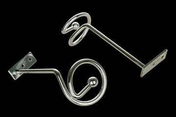 Metal chrome curtain rod Spiral on a black background, close-up. © Oleksandr