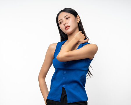 Asian woman has problem with structural posture Back neck and shoulder pain. She massaged her neck and shoulders for relief. reduce muscle tension. Unwell unhealthy on isolated white background