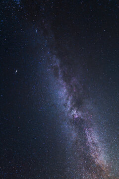 Colorful bright Milky Way galaxy on the starry sky.