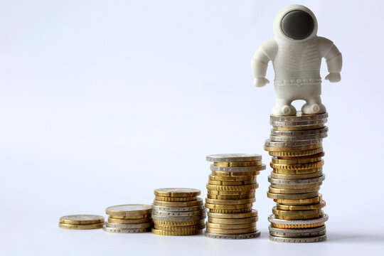AI Stock Market Growth Concept with Rising Coin Stacks and White Figure representing Ai