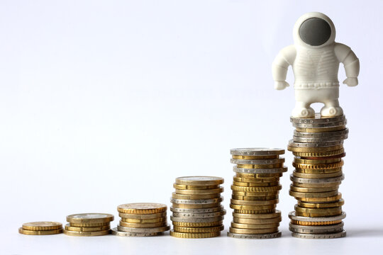 AI Stock Market Growth Concept with Rising Coin Stacks and White Figure representing Ai