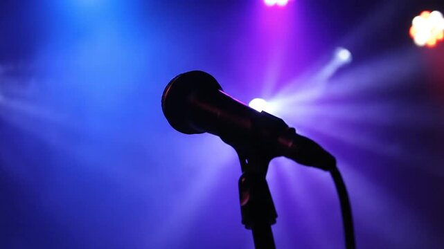 Stage Microphone Silhouette with Dramatic Blue and Purple Spotlights