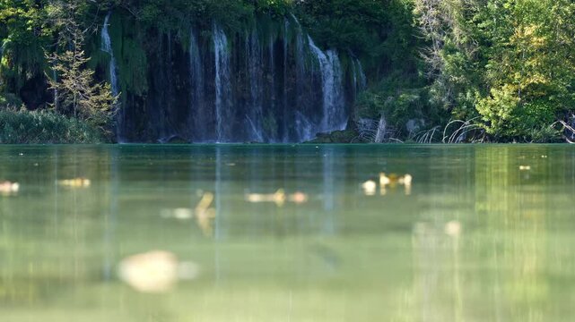 Beauty waterfalls in a wild landscape. Relaxing by the lake with waterfall views. Waterfalls dancing down the rocky mountains. A hidden waterfall deep in the forest. Plitvice Lakes.