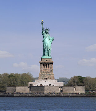 The sculpture, "Liberty Enlightening the World," is located on Liberty Island in New York Harbor.