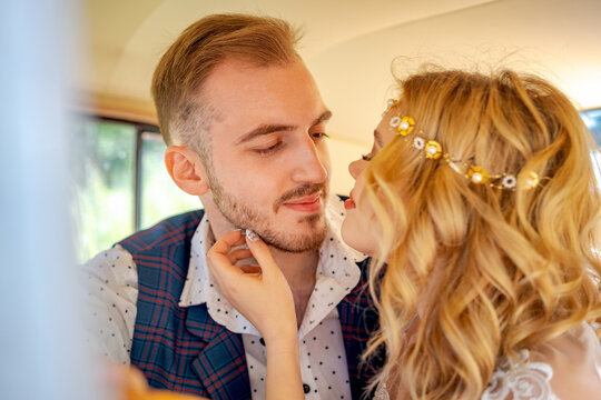 Passionate Young Couple About to Kiss in a Car