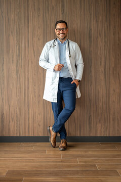 Healthcare professional standing confidently, wearing a lab coat and stethoscope, smiling while embracing a rewarding medical career
