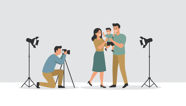 Professional photographer using camera on tripod to take picture of happy young family with small child in studio.