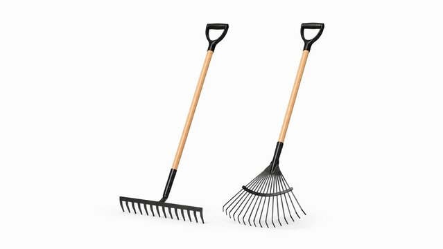 Set of two garden rakes, a traditional bow rake and a leaf fan rake with wooden handles isolated on white background