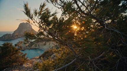 Obraz premium Sunset light shining through pine trees with Es Vedra island and a coastal bay in the background, Mediterranean travel and summer vacation concept in Ibiza.