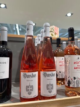 ortuguese regional wines and Mundus vinho leve ros&eacute; bottles displayed on a supermarket shelf, representing local wine culture and souvenir shopping today, 4 April 2026, Sintra, Portugal