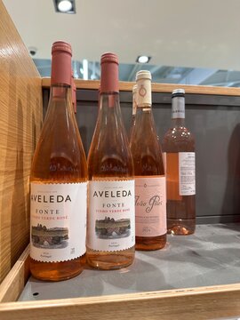 Aveleda Fonte vinho verde ros&eacute; bottles displayed beside other Portuguese ros&eacute; wines on a wooden supermarket shelf, showcasing regional wine retail for shoppers, 4 April 2026, Sintra, Portugal