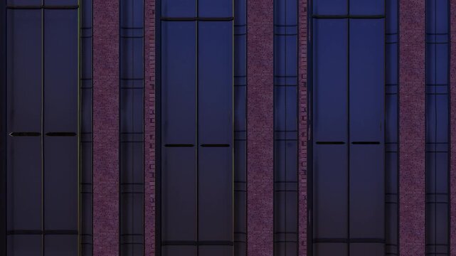 Animation of architectural facade with vertical window modules sliding in alternating directions to create a seamless looping pattern. Modern building exterior with repetitive motion