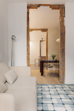 Antique timber beam framing passage to dining room