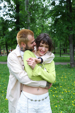 young couple walking in the park