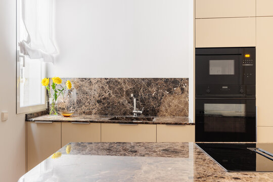 Kitchen marble backsplash with integrated sink and sunflowers