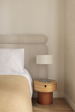 Two-tone bedside table with terracotta base and oak top