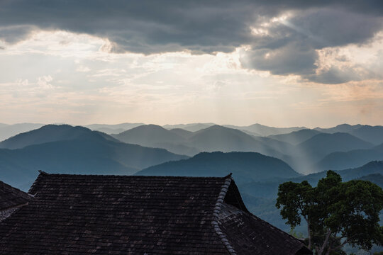 Sunbeams Over Mountain Ranges and Village Rooftop