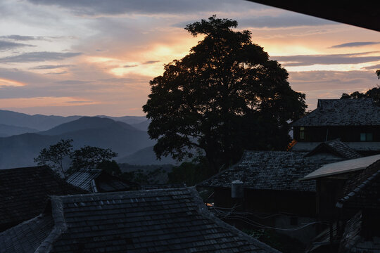 Sunset Over Traditional Mountain Village Rooftops