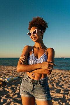 Happy woman enjoying summer vacation at beach