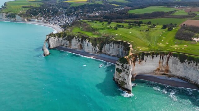 Etretat coastal landscape in northern France, travel destination with iconic chalk cliffs and scenic views over sea