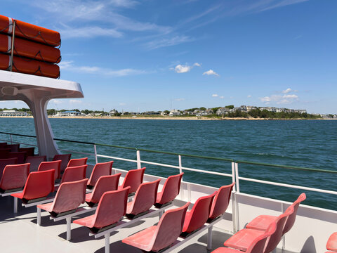 Deck Chairs red on Ocean Ferry boat Nobody