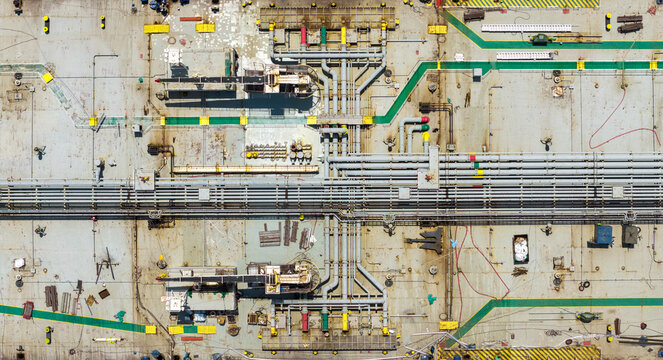 Ship deck aerial view displaying industrial pipeline network