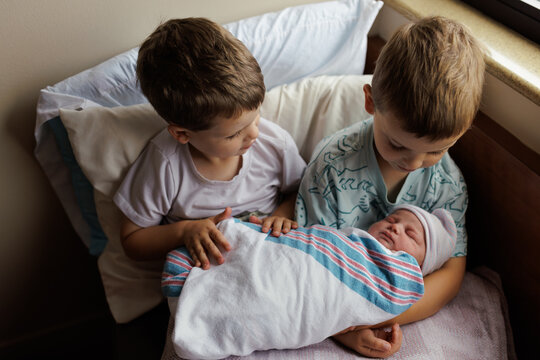 Siblings Meeting Newborn Baby
