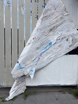 wall with torn poster