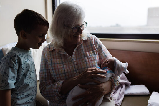 Grandmother and Child with Newborn