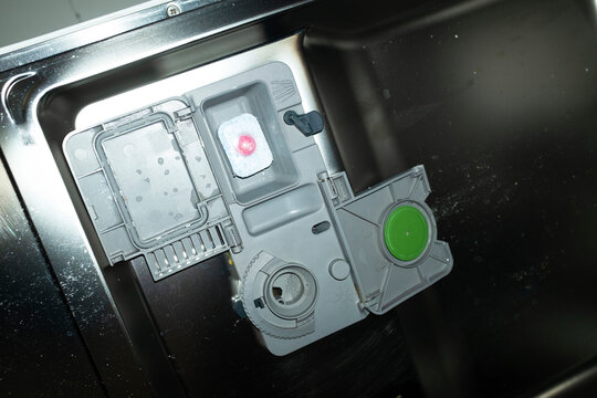 Close-up of modern technology tech dishwasher machine with flashlight