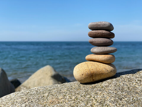 Pebbles balanced on a rock