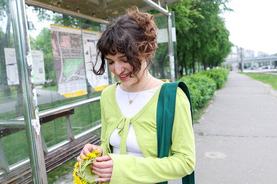 A young woman is walking in city