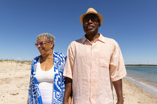 Senior Black Couple relax  walk beach 