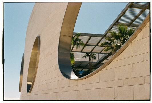 Modern Architecture with Circular Windows and Palm Trees, Lisbon