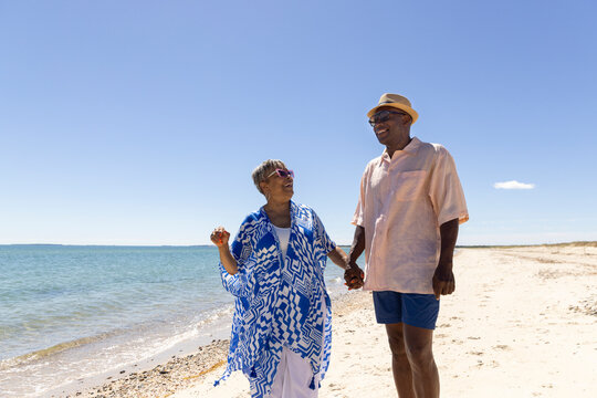 Senior Black Couple in love  walk beach 