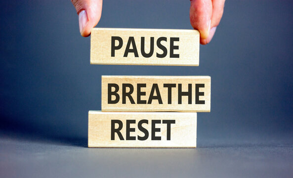 Pause breathe reset words symbol. Concept words Pause breathe reset on beautiful wooden blocks. Beautiful grey background. Business support motivational and pause breathe reset concept. Copy space.