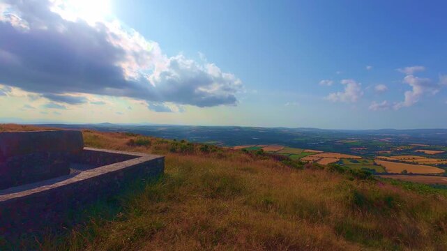 Slow motion stone monument triangulation pillar on hill peak