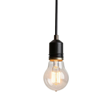 Retro style edison bulb hangs suspended from a black fixture and electrical cord