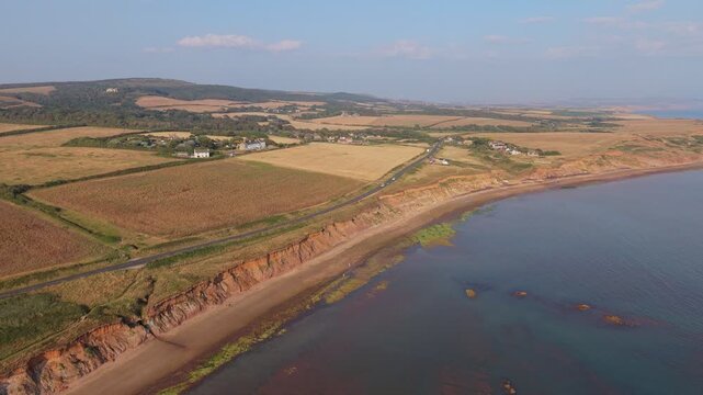 Aerial drone footage of Compton Bay and Brook Chine Beach on the south-west coast of the Isle of Wight, England, showcasing dramatic cliffs, golden sands, turquoise water, and the spectacular coast