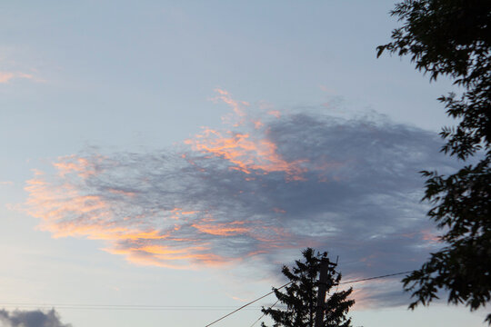 Sunset Sky Over Rural Moldova with Utility Wires and Silhouetted Trees
