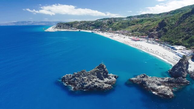 Ulivarella Beach and Ulivo Rock aerial view in slow motion, Calabria, Italy