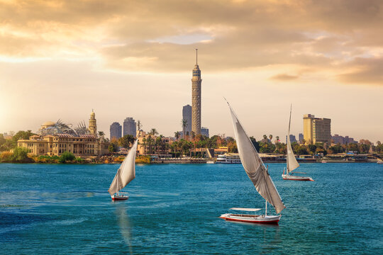 Stunning Sunset View of Cairo Tower and Feluccas on the Nile River