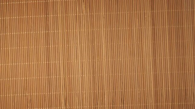 Rotating natural bamboo mat background texture