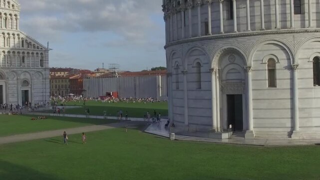 High altitude view of Pisa architectural complex under bright blue summer sky