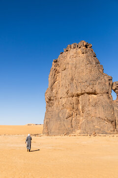 Guide Beside a Towering Rock Pinnacle