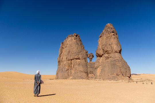 Guide Dwarfed by Twin Rock Pinnacles