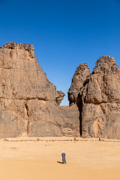 Guide Walking Beneath Twin Rock Pinnacles
