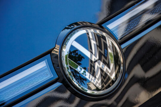 Volkswagen (VW) Logo on the Front of a Brand-New Electric Car in Berlin, Germany.