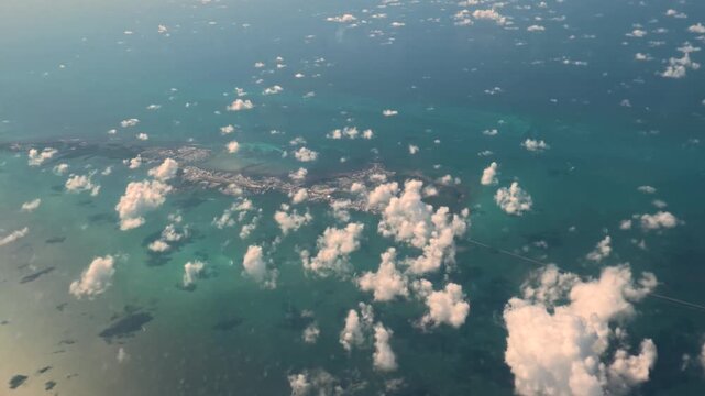 Tropical Overview: 4K Aerial Window View Flying Over the Florida Keys from a Commercial Airplane