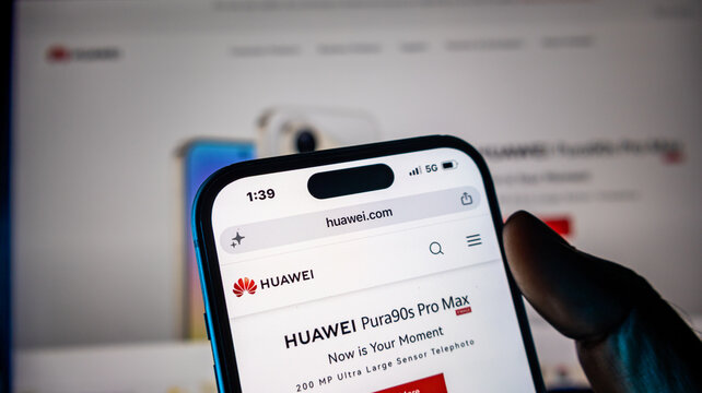 Person browsing huawei website using smartphone.